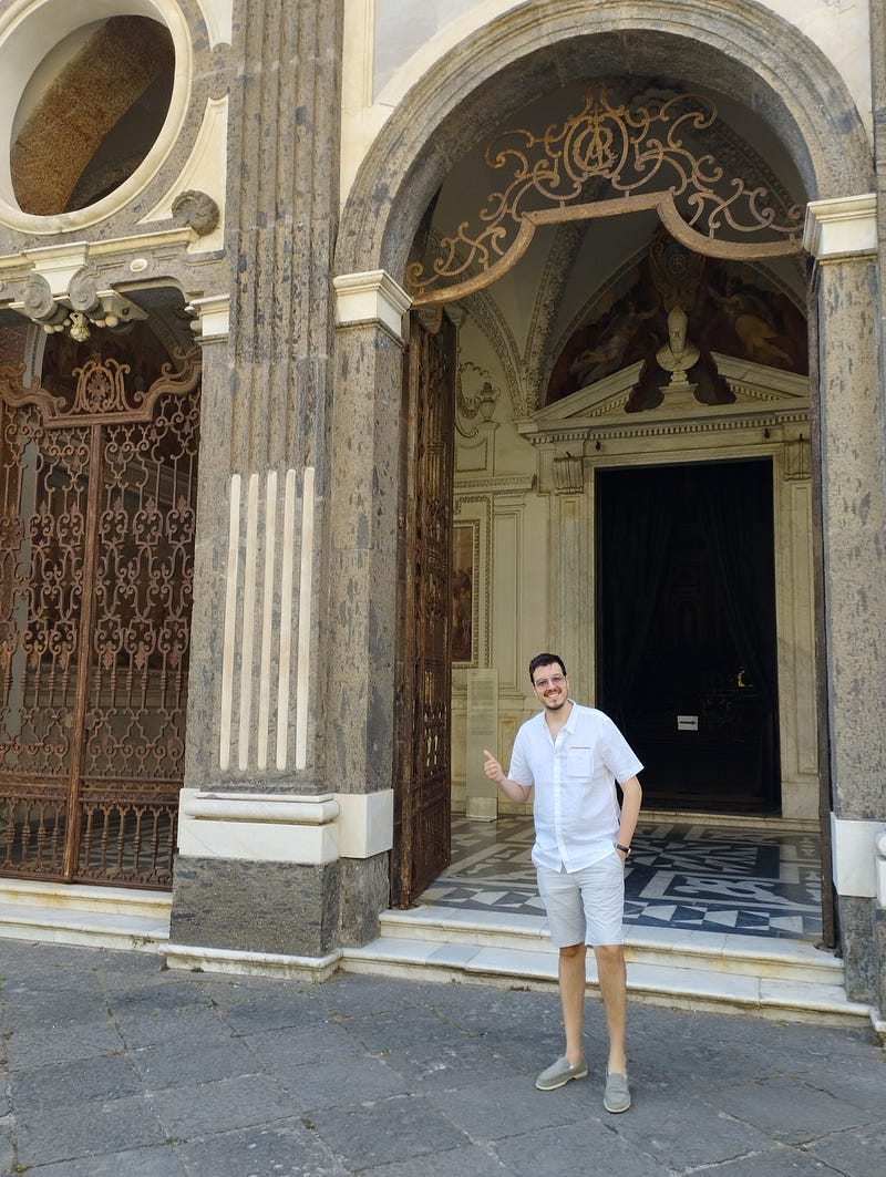 Certosa di San Martino Church. Antonello Mirone (Art Historian), smiling under Venetian Serlina. July 2023.