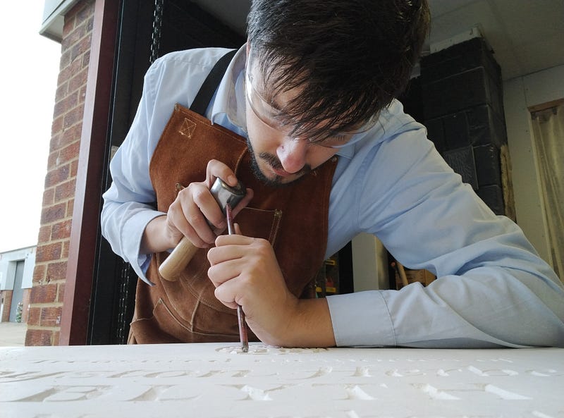 Antonello Mirone, carving a memorial in Canterbury, UK(2024).