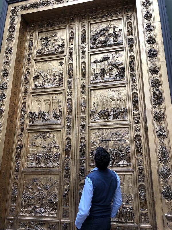 Antonello Mirone (Art Historian & Stonemason) in front of the Gates of Paradise, V&A museum, London.