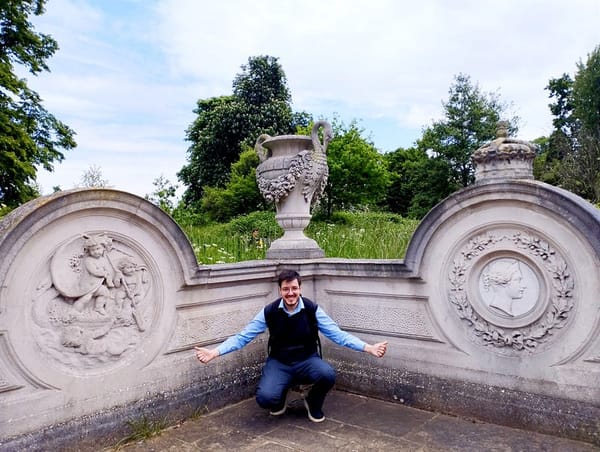 Antonello Mirone (Art Historian) near the carved reliefs in marble and Portland stone. Italian Gardens, London, 2023.